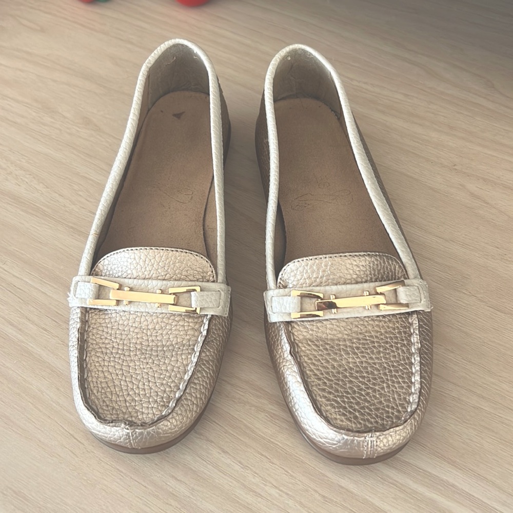 Gold/cream loafers with gold buckle detail